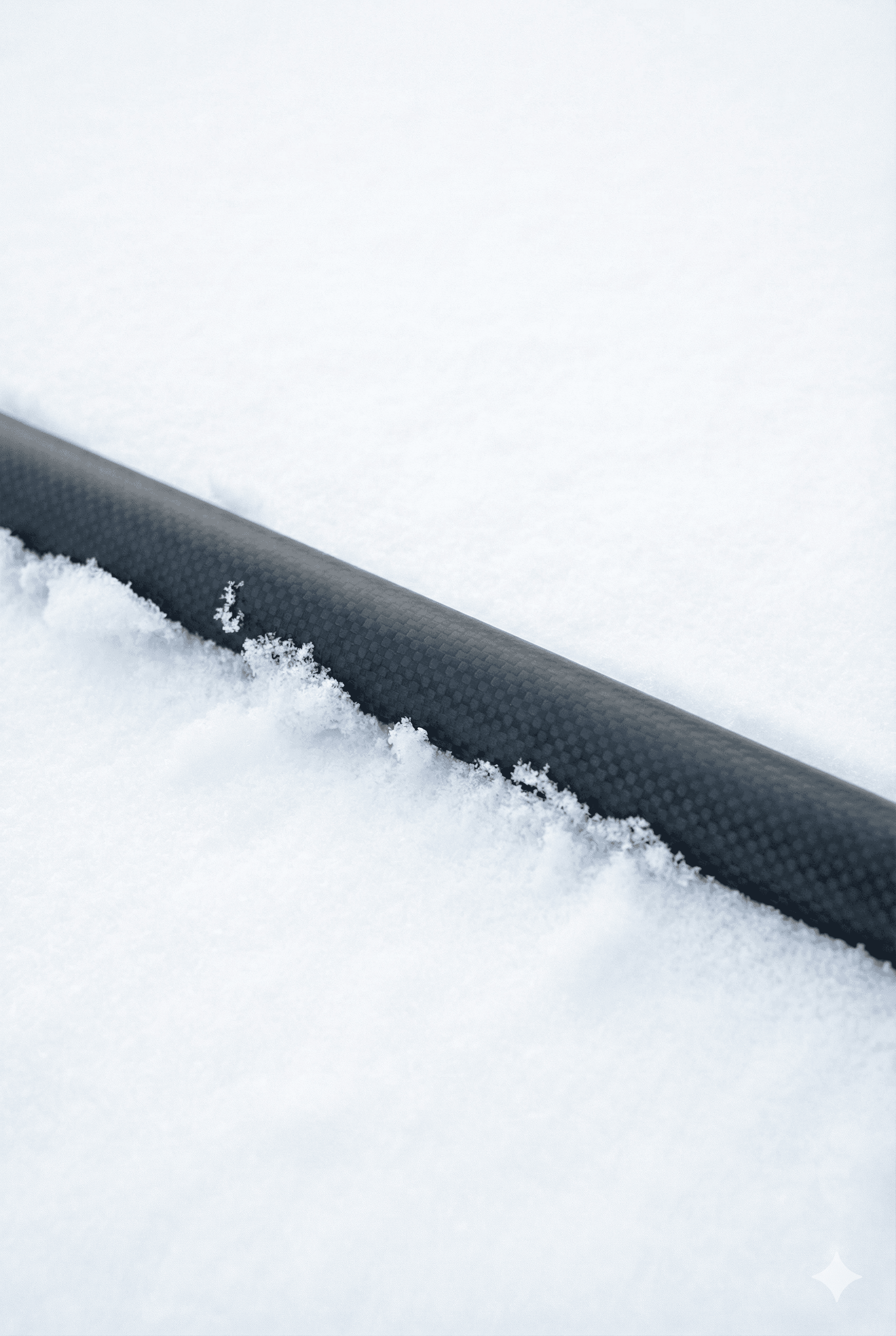 T700 Carbon fiber ski pole shaft in pristine Nordic snow